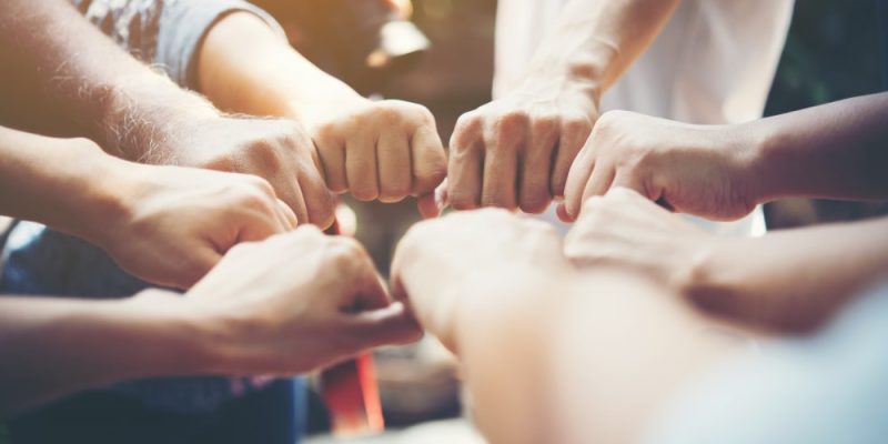 strength-people-hands-success-meeting-min